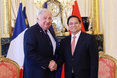 Prime Minister Pham Minh Chinh (R) meets with French Senate President Gérard Larcher in Paris on June 10. (Photo: VNA)