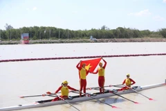 Bui Thi Thu Hien, Nguyen Giang, Dinh Thi Hao, and Pham Thi Hue celebrate after winning gold in the women’s quadruple sculls final at the 33rd SEA Games. ( Photo: VNA)