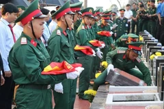 The solemn funeral held for 66 martyrs in Binh Phuoc (Photo: VNA)