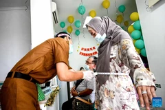 A woman undergoes a health screening on the first day of the Free Health Check (CKG) programme at Ciater Community Health Center in South Tangerang, Banten Province, Indonesia, Feb. 10, 2025. (Photo: english.news.cn)