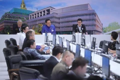 Prime Minister Anutin Charnvirakul (centre) chairs a special meeting of the Joint Management and Monitoring Centre for the Situation in the Middle East on March 19. (Photo: Bangkok Post) 