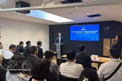 Vu Anh Son, Vietnam's Trade Counsellor in France, speaks at the conference. (Photo: VNA)