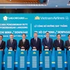 Party General Secretary To Lam (fifth from right) at the official announcement ceremony for Vietnam Airlines' direct route connecting Ho Chi Minh City and Bali resort island’s Denpasar on March 9. (Photo: VNA)