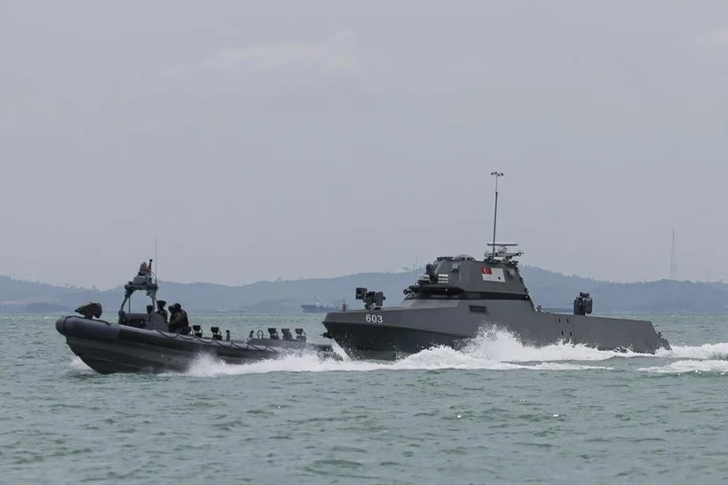 Singapore Navy's new maritime security unmanned surface vessel (right) chasing a suspicious vessel during a demonstration at Changi Naval Base on February 4. (Photo: The Strait Times)