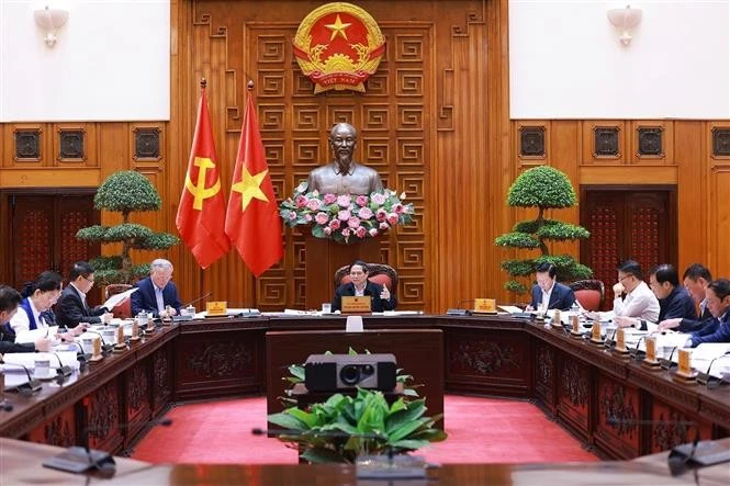 Prime Minister Pham Minh Chinh chairs a session of the Government Party Committee's Standing Board on the administrative reorganisation and the shift to a two-tier local government model. (Photo: VNA)