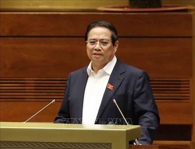 Prime Minister Pham Minh Chinh delivers a speech at the national conference to disseminate and implement the Politburo's Resolutions No. 66-NQ/TW and No. 68-NQ/TW. (Photo: VNA)