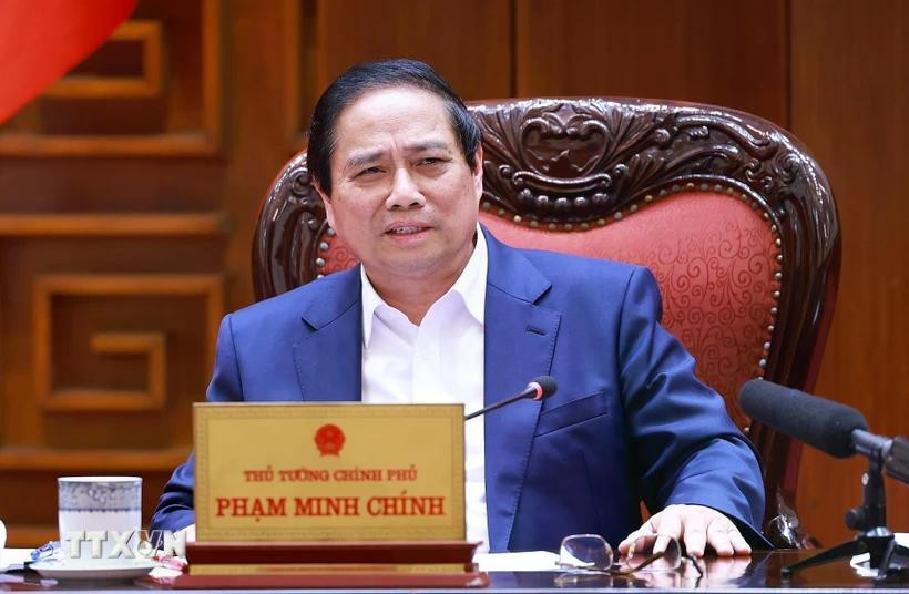 PM chairs a meeting to draft resolutions on breakthroughs in health care, education. (Photo: VNA)