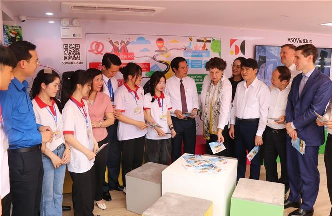 Delegates explore the career-orientation-bus programme. (Photo: VNA) 