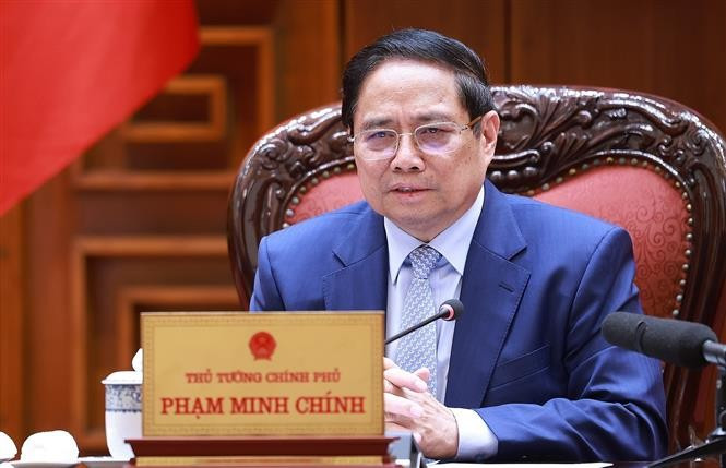 Prime Minister Pham Minh Chinh chairs a meeting on June 28 to continue reviewing and resolving US concerns regarding trade and tariffs. (Photo: VNA)