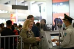 Aviation security staff verify passenger information before security screening at an airport in Vietnam. (Photo: VNA) 