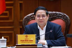 Politburo member, Secretary of the Government’s Party Committee, and Prime Minister Pham Minh Chinh speaks at the conference. (Photo: VNA)