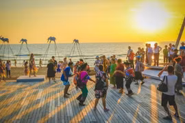 Visitors enjoy the sunset at Sunset Sanato Beach in Phu Quoc. (Photo: VNA)