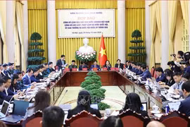 The press conference held on December 20 to announce the newly-adopted laws and ordinance at the Presidential Office. (Photo: VNA)
