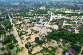 This aerial photo shows residential areas submerged by floods in Padang, West Sumatra on November 25, 2025. (Photo: Antara)