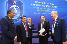 Vietnamese Permanent Deputy Minister of Foreign Affairs Nguyen Minh Vu (second, left) and delegates to the signing ceremony of the United Nations Convention against Cybercrime in Hanoi on the morning of October 25, 2025. (Photo: VNA)