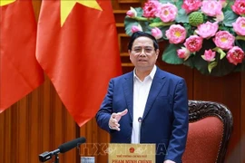 Prime Minister Pham Minh Chinh speaks at the meeting of permanent Government members in Hanoi on December 23. (Photo: VNA)