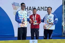 In the men’s 50m breaststroke SB11 event, Nguyen Van Hanh touches home first to claim a gold medal with a time of 36.37 seconds. (Photo: VNA)