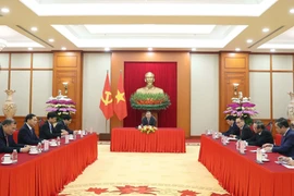 General Secretary of the Communist Party of Vietnam (CPV) Central Committee To Lam and General Secretary of the Communist Party of China (CPC) Central Committee and President of China Xi Jinping talk over the phone on January 15. (Photo: VNA)