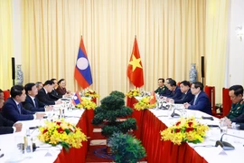 At the meeting between Prime Minister Phạm Minh Chinh and General Secretary of the Lao People’s Revolutionary Party (LPRP) and President of Laos Thongloun Sisoulith in Ho Chi Minh City on April 29. (Photo: VNA)