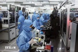 Foreign investment inflows in the first 11 months of 2025 remained positive, with nearly 33.7 billion USD in newly registered capital and 23.6 billion USD in disbursed capital – the highest in five years. (Photo: VNA)