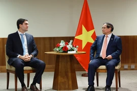 Prime Minister Pham Minh Chinh meets a representative of Vale, a multinational group specialising in metals, mining, and logistics, in Brazil's Rio de Janeiro city on July 7 (local time). (Photo: VNA)