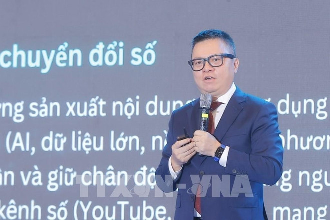 Vice Chairman of the Party Central Committee’s Commission for Information, Education and Mass Mobilisation, Editor-in-Chief of Nhan Dan Newspaper, and Chairman of the Vietnam Journalists’ Association (VJA) Le Quoc Minh speaks at the event. (Photo: VNA) mi.jpg