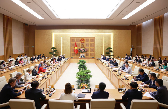 At the working session (Photo: VNA) wo.jpg