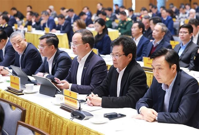 Delegates attending conference between permanent Cabinet members and leaders from SOEs (Photo: VNA)