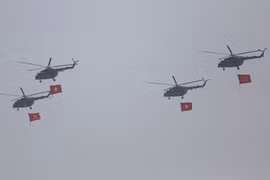 Helicopters rehearse flag display for 50th anniversary of national reunification