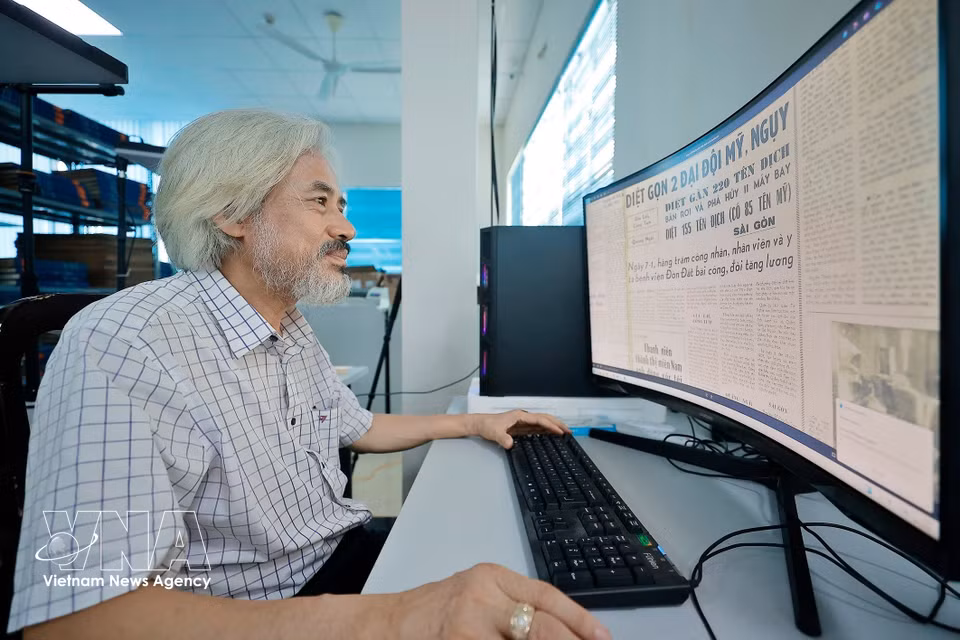 Mr. Dung digitizes his extensive newspaper archive. (Photo: Minh Quyet/VNA)