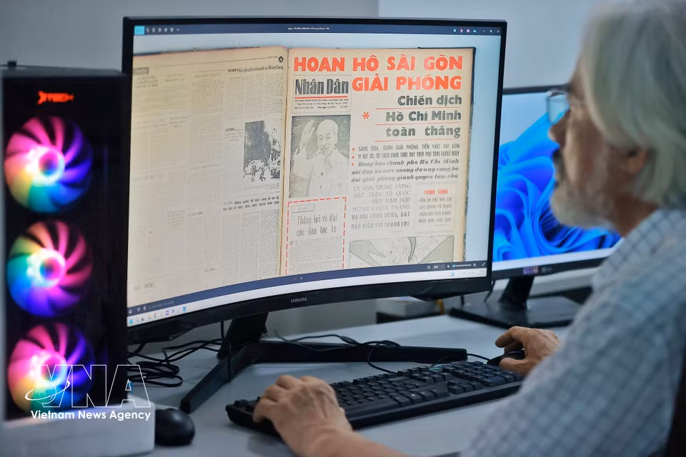 Mr. Dung digitizes his extensive newspaper archive. (Photo: Minh Quyet/VNA)