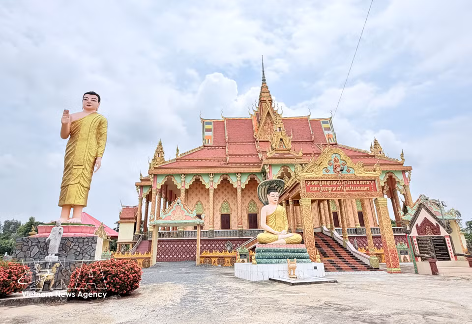 Visitors are greeted at the entrance to the main hall by an impressive 10m-high standing Buddha statue. (Photo: Thanh Sang – VNA)
