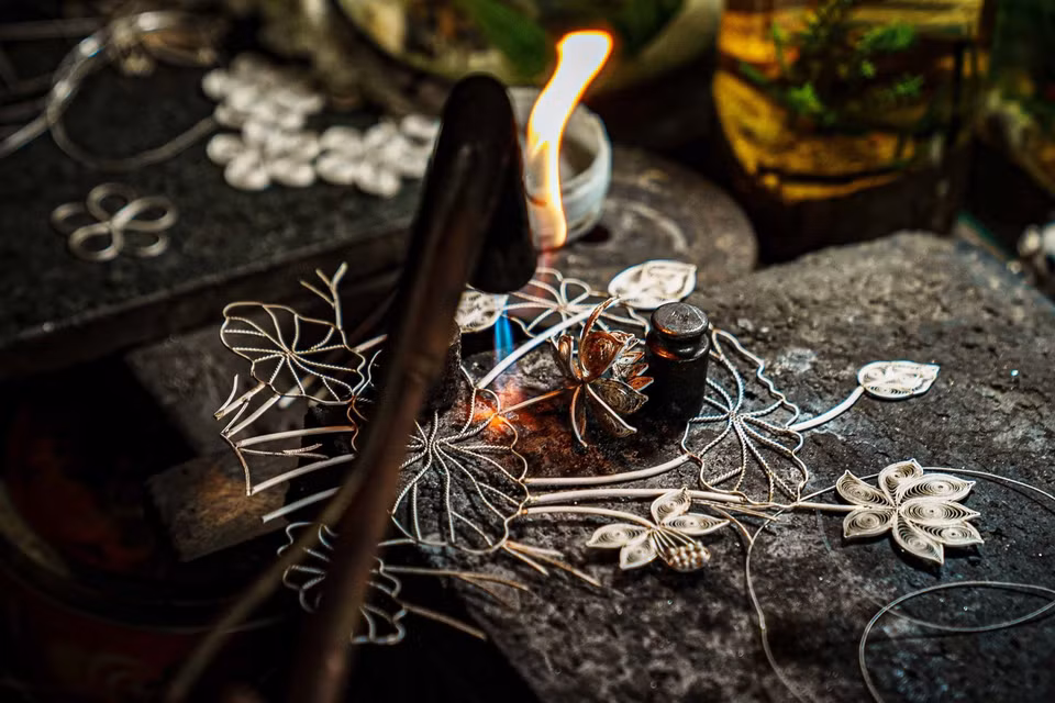 The lotus painting, rich in detail and small patterns, is being welded by the goldsmiths of Dinh Cong. (Photo: VNA)