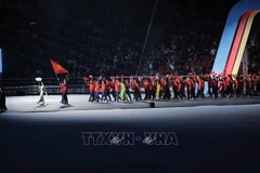 The Vietnam sports delegation at the opening ceremony of SEA Games 33. (Photo: VNA)