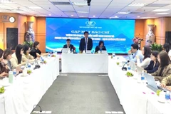 Vinatex holds a briefing in Hanoi on December 24. (Photo: VNA)