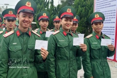 Soldiers in Con Co special zone of Quang Tri province enthusisastically join the general election on March 15. (Photo: VNA)