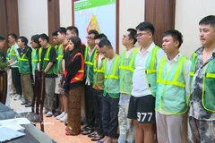 The suspects at the police station (Photo: VNA)