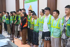 The suspects at the police station (Photo: VNA)