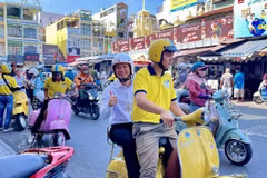 Tourists experience exploring Ho Chi Minh City by Vespa scooter. (Photo: VNA)