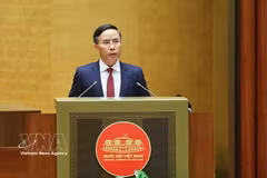 SBV Governor Pham Duc An presents a proposal on a draft law amending and supplementing a number of articles of the Law on the State Bank of Vietnam, the Law on Anti-Money Laundering, and the Law on Credit Institutions at the 16th National Assembly’s first extraordinary session on August 5 (Photo: VNA)