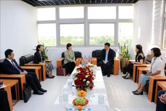 At the working session (Photo: VNA)