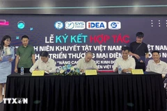 The agreement signing ceremony in Hanoi on July 10 (Photo: VNA)