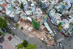 Aerial view of cleared land and ongoing demolition at the site of HCM City's Metro Line 2 project. (Photo: thesaigontimes.vn)