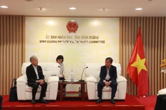 At the working session (Photo: VNA)
