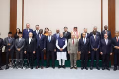 Ministers and deputy ministers from BRICS member and partner countries pose for a group photo while attending the Expanded BRICS Foreign Ministers' Meeting in India on May 14. (Photo: VNA)