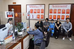 The two-tier local administration model has received strong support from citizens and businesses. (Photo: VNA)