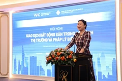 Ho Thi Quyen, deputy director of the HCM City Investment and Trade Promotion Centre, speaks at a conference titled ‘Real Estate Transactions in a Volatile Market and Legal Context’ in HCM City on August 28. Photo courtesy of ITPC)