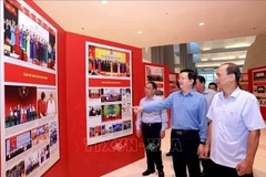 Deputy Prime Minister Mai Van Chinh (2nd from right) inspects preparations for the exhibitions on October 11. (Photo: VNA)