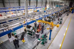 Workers assemble parts on an automotive production line in HCM City. The city’s industrial sector is showing strong signs of recovery. (Photo: moit.gov.vn)