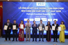 Twenty-seven companies are honoured as Vietnam excellent suppliers at a ceremony held in Hanoi on January 29. (Photo: VNA)